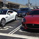 The F-Type next to its cleaner, less eggy brother.